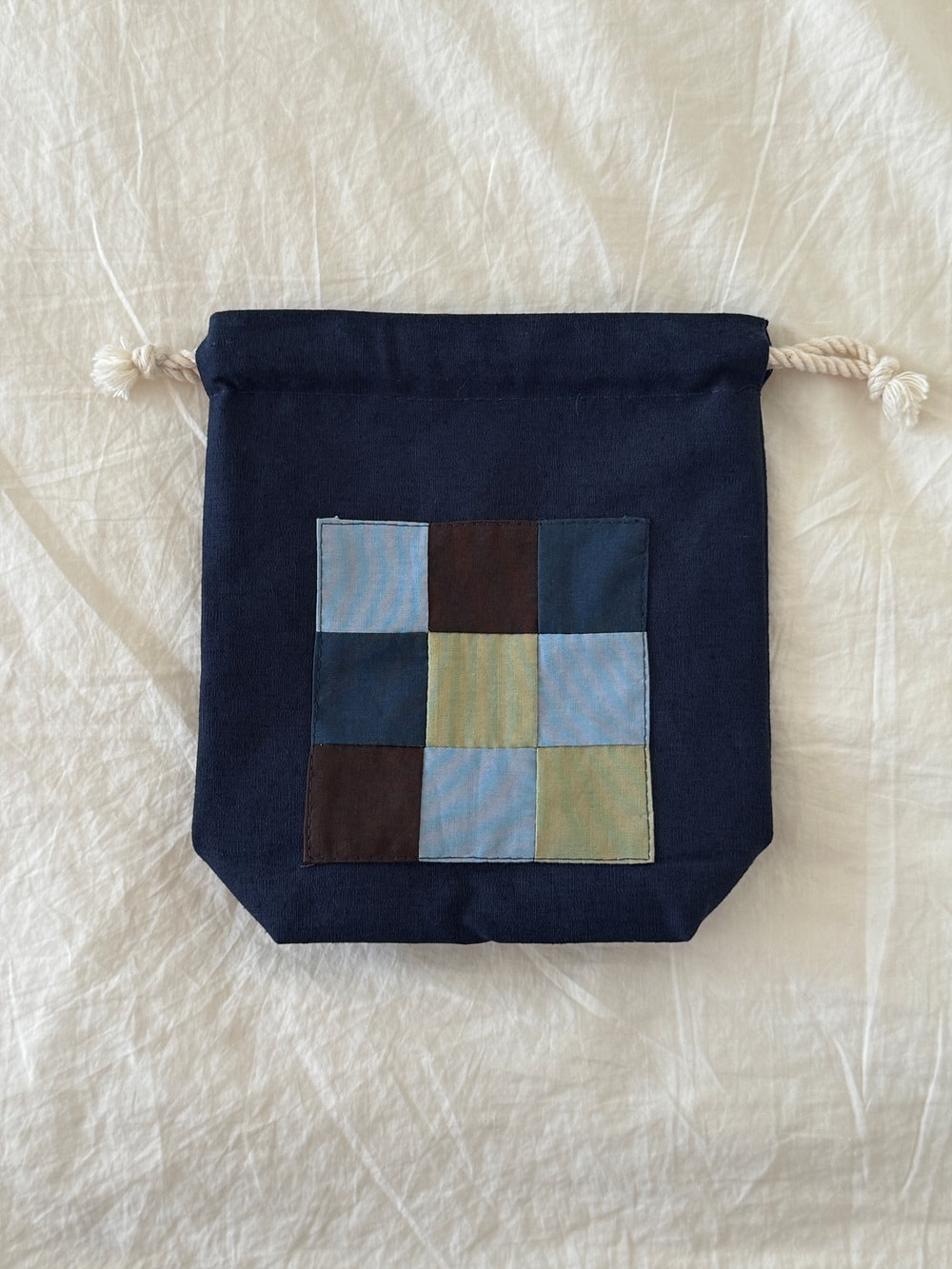 [공식몰 한정] Piece by piece String pouch Navy