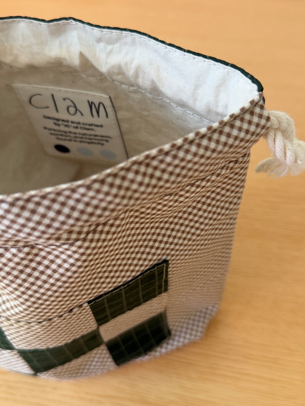 [공식몰 한정] Piece by piece String pouch Check Green